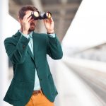 Businessman looking for with binoculars