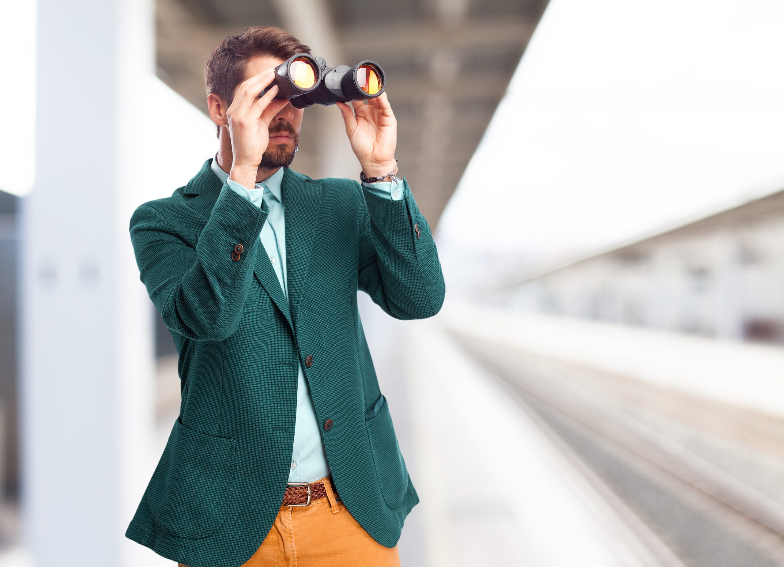 Businessman looking for with binoculars